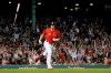 Fans cheer as Boston Red Sox's Hunter Renfroe tosses his bat after hitting a three-run home run during the seventh inning of the team's baseball game against the Cleveland Indians at Fenway Park, Friday, Sept. 3, 2021, in Boston. (AP Photo/Mary Schwalm)