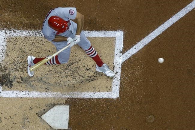 St. Louis Cardinals' Adam Wainwright hits an RBI single during the second inning of a baseball game against the Milwaukee Brewers Friday, Sept. 3, 2021, in Milwaukee. (AP Photo/Morry Gash)
