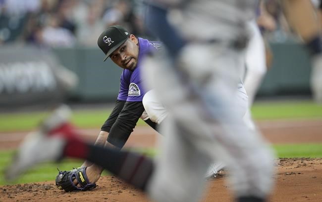 Colorado Rockies starting pitcher Antonio Senzatela watches from the mound as Atlanta Braves' Dansby Swanson is put out at first base during the second inning of a baseball game in Denver, Friday, Sept. 3, 2021. Colorado won 4-3. (AP Photo/Joe Mahoney)