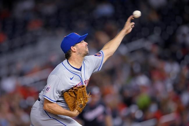 New York Mets starter Rich Hill delivers a pitch during the third inning of the team's baseball game against the Washington Nationals, Friday, Sept. 3, 2021, in Washington. (AP Photo/Nick Wass)