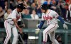 Atlanta Braves third base coach Ron Washington, left, congratulates pinch hitter Travis d'Arnaud as d'Arnaud circles the bases after hitting a solo home run off Colorado Rockies relief pitcher Carlos Estevez in the ninth inning of a baseball game Saturday, Sept. 4, 2021, in Denver. (AP Photo/David Zalubowski)