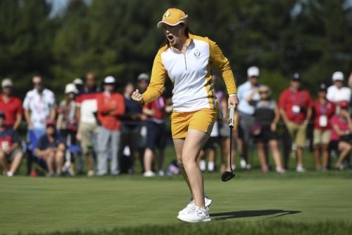 Europe's Leona Maguire celebrates after a putt on the 14th hole during the foursome matches at the Solheim Cup golf tournament, Sunday, Sept. 5, 2021, in Toledo, Ohio. (AP Photo/David Dermer)