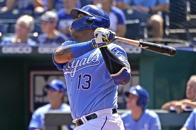 Kansas City Royals' Salvador Perez hits a three-run home run during the first inning of a baseball game against the Chicago White Sox Sunday, Sept. 5, 2021, in Kansas City, Mo. (AP Photo/Charlie Riedel)