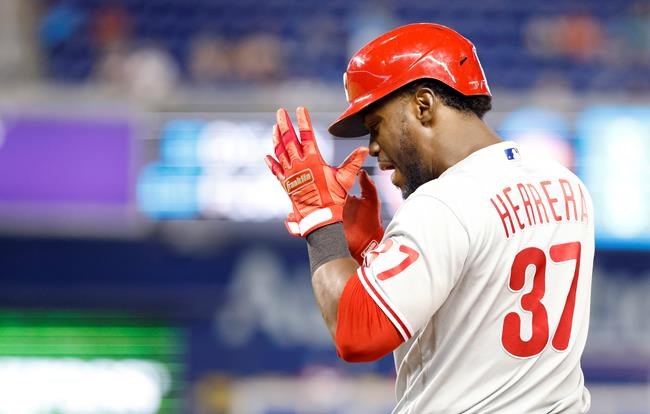 Philadelphia Phillies' Odubel Herrera (37) reacts after singling in a run during the 10th inning of a baseball game against the Miami Marlins, Sunday, Sept. 5, 2021, in Miami. (AP Photo/Rhona Wise)