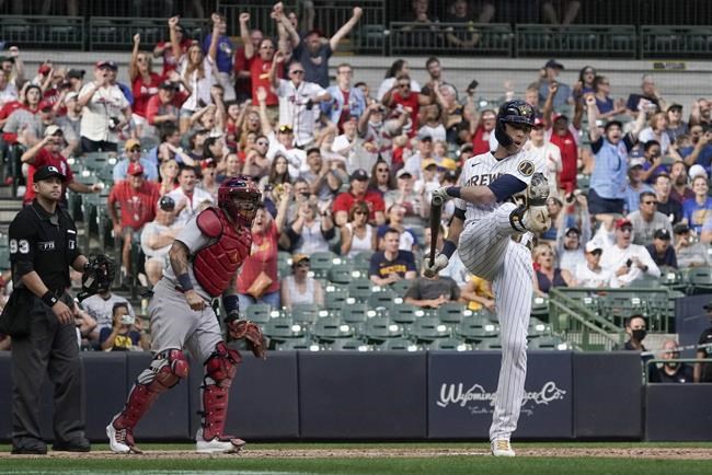 Milwaukee Brewers' Christian Yelich reacts after lining out with bases loaded during the eighth inning of a baseball game against the St. Louis Cardinals Sunday, Sept. 5, 2021, in Milwaukee. (AP Photo/Morry Gash)