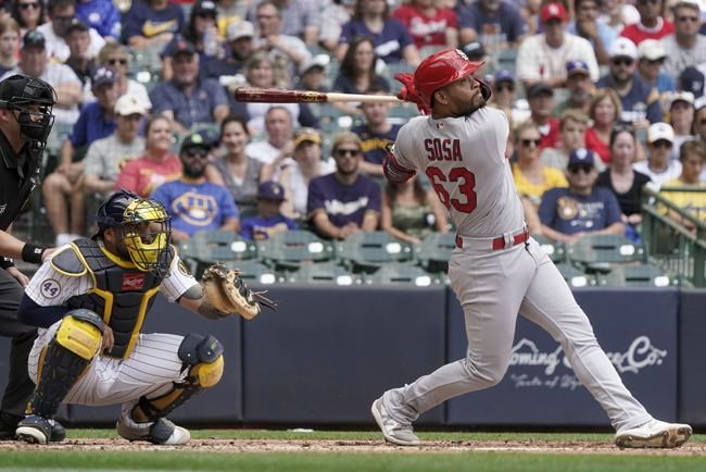 St. Louis Cardinals' Edmundo Sosa hits an RBI sacrifice fly during the fourth inning of a baseball game against the Milwaukee Brewers Sunday, Sept. 5, 2021, in Milwaukee. (AP Photo/Morry Gash)