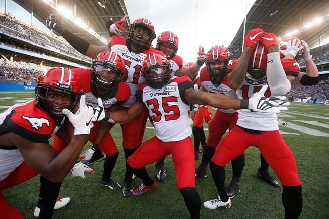 Calgary Stampeders' Ka'Deem Carey (35) and teammates celebrate Carey’s touchdown during first half CFL action against the Winnipeg Blue Bombers, in Winnipeg, Sunday, Aug. 29, 2021. The Calgary Stampeders will have history on their side Monday when they host the Edmonton Elks. THE CANADIAN PRESS/John Woods