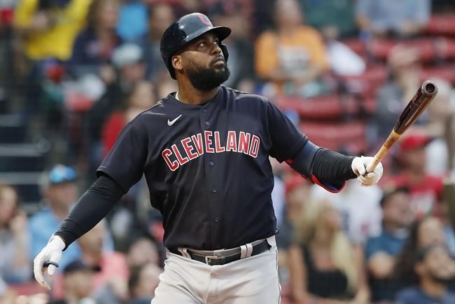 Cleveland Indians' Franmil Reyes watches his two-run double during the ninth inning of a baseball game against the Boston Red Sox, Sunday, Sept. 5, 2021, in Boston. (AP Photo/Michael Dwyer)