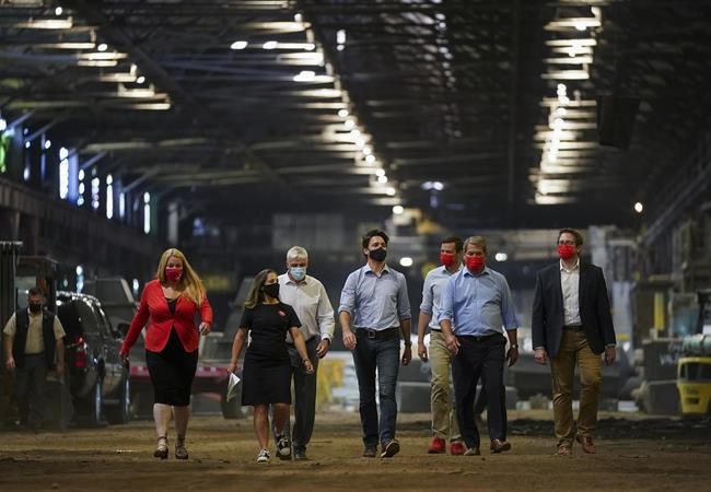 Liberal Leader Justin Trudeau, centre, along with Liberal candidates, makes a campaign stop at a steel plant during the Canadian federal election campaign in Welland, Ont., Monday, Sept. 6, 2021. THE CANADIAN PRESS/Nathan Denette