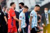 From right, Argentina's players Nicolas Otamendi, Giovani Lo Celso and goalkeeper Emiliano Martinez, walk off the field after the qualifying soccer match for the FIFA World Cup Qatar 2022 against Brazil was interrupted by health officials in Sao Paulo, Brazil, Sunday, Sept.5, 2021. (AP Photo/Andre Penner)