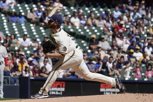 Milwaukee Brewers starting pitcher Brandon Woodruff throws during the first inning of a baseball game against the Philadelphia Phillies Monday, Sept. 6, 2021, in Milwaukee. (AP Photo/Morry Gash)