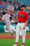 Cleveland Indians starting pitcher Logan Allen, right, waits for Minnesota Twins' Jorge Polanco, back left, to run the bases after hitting a solo home run in the third inning of a baseball game, Monday, Sept. 6, 2021, in Cleveland. (AP Photo/Tony Dejak)