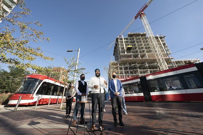 NDP Leader Jagmeet Singh stands with local candidates Norm DiPasquale for Spadina Fort York and Brian Chang for Toronto Centre, during an election campaign stop in Toronto, Tuesday, September 7, 2021. THE CANADIAN PRESS/Jonathan Hayward