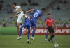 Portugal's Joao Palhinha, left, challenges for the ball with Azerbaijan's Mahir Emreli during the World Cup 2022 group A qualifying soccer match between Azerbaijan and Portugal at the Olympic stadium in Baku, Azerbaijan, Tuesday, Sept. 7, 2021. (AP Photo/Aziz Karimov)