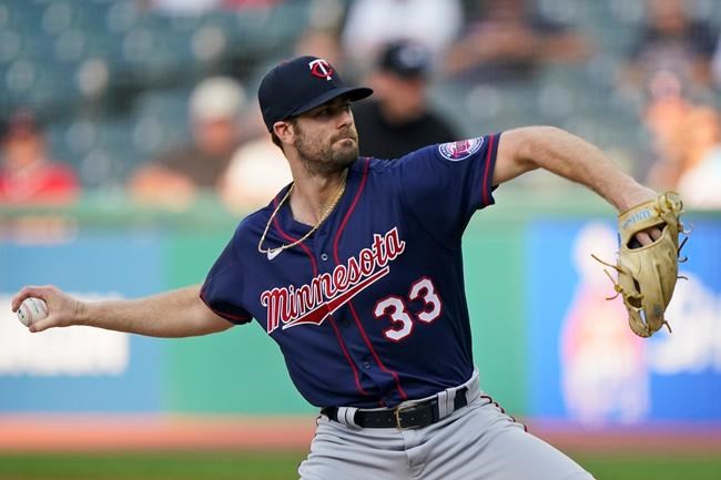 Minnesota Twins starting pitcher John Gant delivers in the first inning of the team's baseball game against the Cleveland Indians, Tuesday, Sept. 7, 2021, in Cleveland. (AP Photo/Tony Dejak)