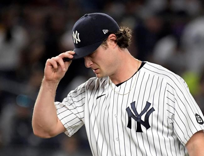 New York Yankees pitcher Gerrit Cole pauses during the fourth inning of the team's baseball game against theToronto Blue Jays on Tuesday, Sept. 7, 2021, at Yankee Stadium in New York. (AP Photo/Bill Kostroun)