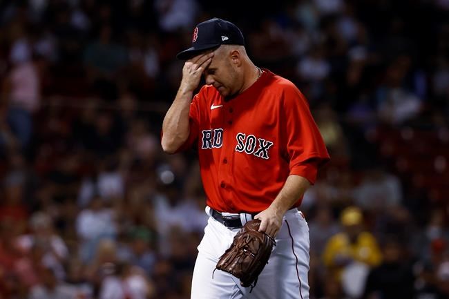 Boston Red Sox relief pitcher Brad Peacock heads for the dugout after giving up four runs to the Tampa Bay Rays during the seventh inning of a baseball game Tuesday, Sept. 7, 2021, at Fenway Park in Boston. (AP Photo/Winslow Townson)