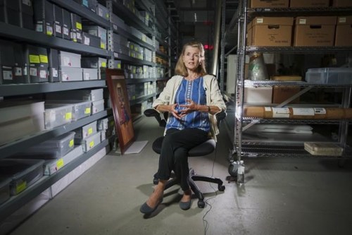 Jan Ramirez, chief curator at the 9/11 Memorial & Museum, sits for an interview inside a warehouse where thousands of artifacts from the 9/11 attacks are archived, July 16, 2021, in Jersey City, N.J. Over the years, the museum has collected some 22,000 personal artifacts to help tell the stories of those who died and those lucky to survive. Many of those personal effects were plucked from the ruins of what was once the Twin Towers. Other items were donated by survivors or by the families of those who perished. (AP Photo/Robert Bumsted)