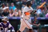 San Francisco Giants' Brandon Crawford watches his three-run home run off Colorado Rockies starting pitcher Jon Gray during the sixth inning of a baseball game Wednesday, Sept. 8, 2021, in Denver. (AP Photo/David Zalubowski)