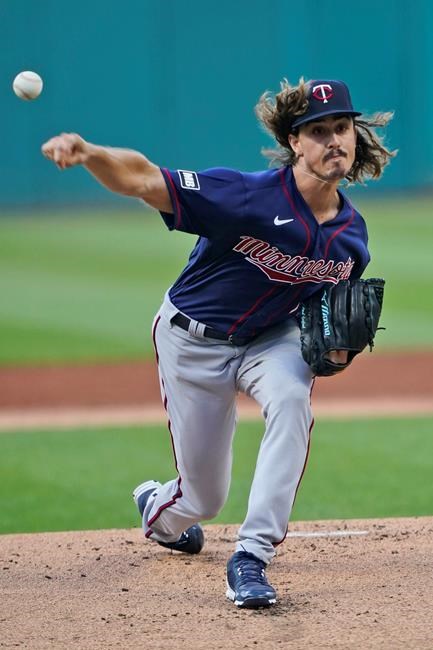 Minnesota Twins starting pitcher Joe Ryan delivers during the first inning of the team's baseball game against the Cleveland Indians, Wednesday, Sept. 8, 2021, in Cleveland. (AP Photo/Tony Dejak)