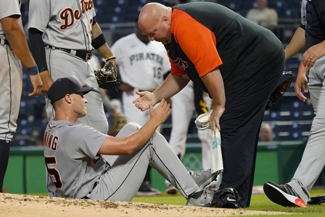 Detroit Tigers starter Matt Manning, left, is helped up after he was hit by a line drive from Pittsburgh Pirates' Colin Moran during the third inning of a baseball game Wednesday, Sept. 8, 2021, in Pittsburgh. Manning walked off with help, leaving the game. (AP Photo/Keith Srakocic)