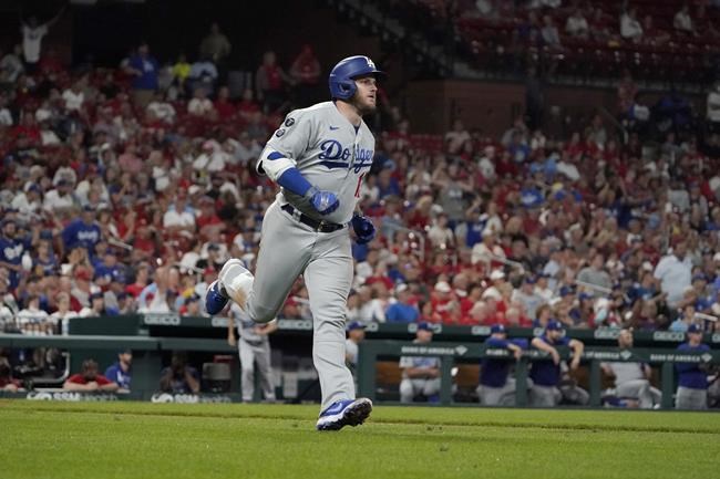 Los Angeles Dodgers' Max Muncy rounds the bases after hitting a solo home run during the sixth inning of a baseball game against the St. Louis Cardinals Wednesday, Sept. 8, 2021, in St. Louis. (AP Photo/Jeff Roberson)