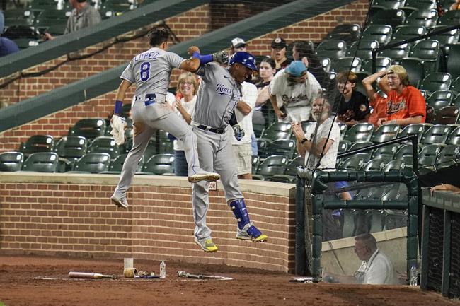 Kansas City Royals' Salvador Perez, right, celebrates his solo home run against the Baltimore Orioles with Nicky Lopez (8) during the seventh inning of baseball game, Wednesday, Sept. 8, 2021, in Baltimore. (AP Photo/Julio Cortez)