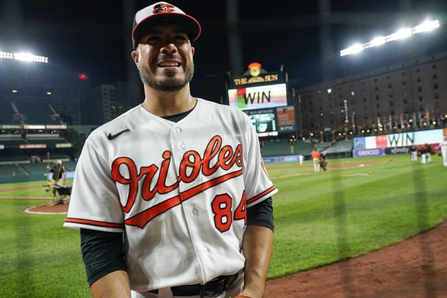 Baltimore Orioles relief pitcher Manny Barreda looks on after he recorded the win during his professional debut in a baseball game against the Kansas City Royals, Wednesday, Sept. 8, 2021, in Baltimore. The Orioles won 9-8. (AP Photo/Julio Cortez)