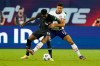 Canada defender Alphonso Davies (19) and United States' Miles Robinson (12) battle for the ball during the first half of a World Cup soccer qualifier Sunday, Sept. 5, 2021, in Nashville, Tenn. THE CANADIAN PRESS/AP/Mark Humphrey