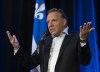 Quebec Premier François Legault responds to reporters' questions regarding the federal election debate, before entering a pre-session party caucus Thursday, Sept. 9, 2021, in Quebec City. THE CANADIAN PRESS/Jacques Boissinot