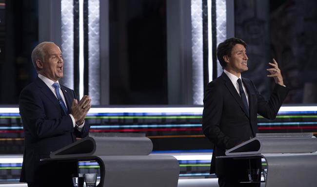 Liberal leader Justin Trudeau and Conservative leader Erin O'Toole try to get their points across during the federal election French-language leaders debate, Wednesday, September 8, 2021 in Gatineau, Que. THE CANADIAN PRESS/Justin Tang