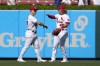 St. Louis Cardinals' Tyler O'Neill, left, and teammate Harrison Bader celebrate a 2-1 victory over the Los Angeles Dodgers in a baseball game Thursday, Sept. 9, 2021, in St. Louis. (AP Photo/Jeff Roberson)