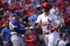 St. Louis Cardinals' Tyler O'Neill (27) scores past Los Angeles Dodgers catcher Austin Barnes after hitting a solo home run during the fifth inning of a baseball game Thursday, Sept. 9, 2021, in St. Louis. (AP Photo/Jeff Roberson)
