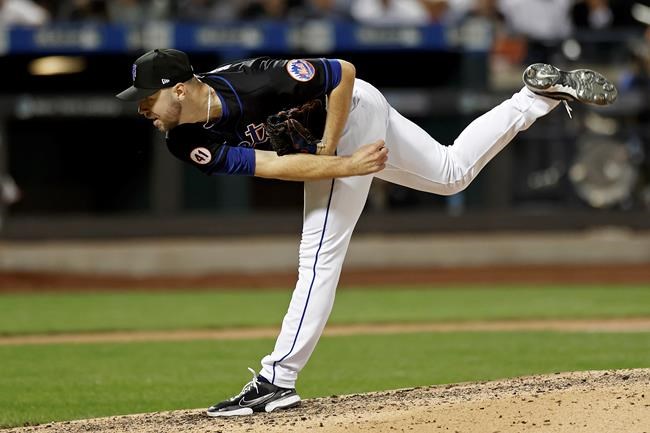 New York Mets pitcher Tylor Megill delivers to the New York Yankees during the seventh inning of a baseball game on Friday, Sept. 10, 2021, in New York. (AP Photo/Adam Hunger)