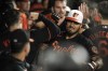 Baltimore Orioles' Anthony Santander, center, is greeted in the dugout by teammates after hitting a three-run home run off Toronto Blue Jays starting pitcher Julian Merryweather during the seventh inning of a baseball game, Friday, Sept. 10, 2021, in Baltimore. (AP Photo/Julio Cortez)