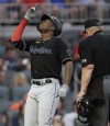 Miami Marlins' Jesus Sanchez celebrates after hitting a two-run home run off Atlanta Braves pitcher Ian Anderson during the first inning of a baseball game Friday, Sept. 10, 2021, in Atlanta. (AP Photo/Ben Margot)