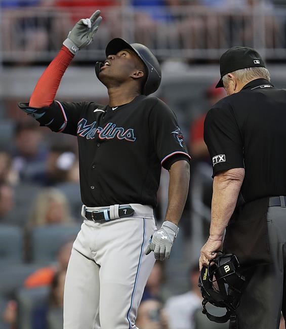 Miami Marlins' Jesus Sanchez celebrates after hitting a two-run home run off Atlanta Braves pitcher Ian Anderson during the first inning of a baseball game Friday, Sept. 10, 2021, in Atlanta. (AP Photo/Ben Margot)