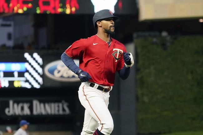 Minnesota Twins' Byron Buxton jogs home on a solo h one run off Kansas City Royals pitcher Daniel Lynch during the first inning of a baseball game Friday, Sept. 10, 2021, in Minneapolis. (AP Photo/Jim Mone)