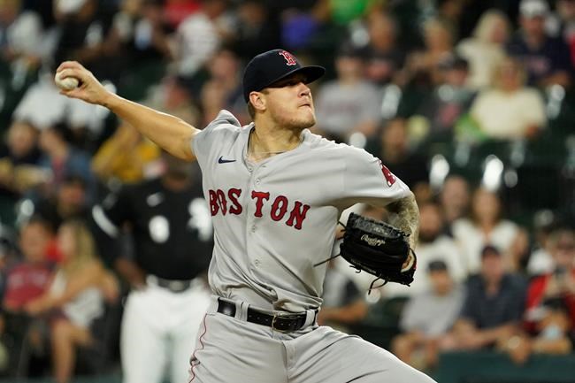 Boston Red Sox starting pitcher Tanner Houck throws against the Chicago White Sox during the first inning of a baseball game, Friday, Sept. 10, 2021, in Chicago. (AP Photo/David Banks)