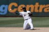 Oakland Athletics' Elvis Andrus (17) throws out Texas Rangers' Nathaniel Lowe from his knees in the sixth inning of a baseball game Saturday, Sept. 11, 2021, in Oakland. (AP Photo/Scot Tucker)
