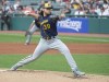 Milwaukee Brewers starting pitcher Corbin Burnes delivers against the Cleveland Indians during the first inning of a baseball game in Cleveland, Saturday, Sept. 11, 2021. (AP Photo/Phil Long)