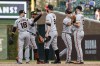 San Francisco Giants players celebrate the team's 15-4 win over the Chicago Cubs in a baseball game, Saturday, Sept. 11, 2021, in Chicago. (AP Photo/Kamil Krzaczynski)