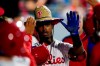 Philadelphia Phillies' Jean Segura celebrates in the dugout after hitting a home run off Colorado Rockies pitcher Kyle Freeland during the fifth inning of a baseball game, Saturday, Sept. 11, 2021, in Philadelphia. (AP Photo/Matt Slocum)