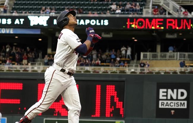 Minnesota Twins' Jorge Polanco jogs home on a solo home run off Kansas City Royals pitcher Brady Singer in the first inning of a baseball game, Saturday, Sept. 11, 2021, in Minneapolis. (AP Photo/Jim Mone)
