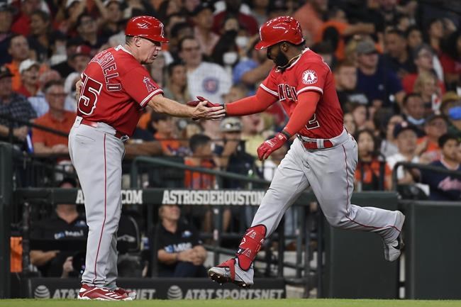 Los Angeles Angels' Luis Rengifo celebrates his two-run home run with third base coach Brian Butterfield during the third inning of a baseball game against the Houston Astros, Saturday, Sept. 11, 2021, in Houston. (AP Photo/Eric Christian Smith)