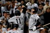 New York Yankees' Aaron Judge, right, congratulates Brett Gardner on hitting a two-run home run against the New York Mets during the second inning of a baseball game on Saturday, Sept. 11, 2021, in New York. (AP Photo/Adam Hunger)
