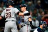 Arizona Diamondbacks' Daulton Varsho, center, is congratulated at home by Seth Beer (28) on Varsho's two-run home run against the Seattle Mariners during the fourth inning of a baseball game Saturday, Sept. 11, 2021, in Seattle. (AP Photo/Elaine Thompson)