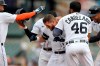 Detroit Tigers' Robbie Grossman, middle, is congratualted by teammates after walking in the winning run with the bases loaded against the Tampa Bay Rays in the eleventh inning of a baseball game, Sunday, Sept. 12, 2021, in Detroit. (AP Photo/Jose Juarez)