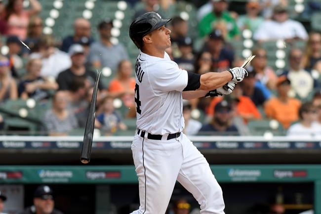 Detroit Tigers catcher Dustin Garneau breaks his bat as he hits a double against the Tampa Bay Rays in the third inning of a baseball game, Sunday, Sept. 12, 2021, in Detroit. (AP Photo/Jose Juarez)