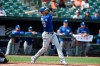 Toronto Blue Jays' Lourdes Gurriel Jr. follows through on a grand slam against the Baltimore Orioles in the first inning of a baseball game Sunday, Sept. 12, 2021, in Baltimore. (AP Photo/Gail Burton)